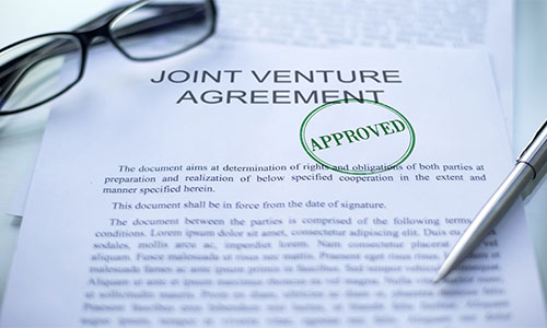 What is a Qualified Joint Venture and How Does it Work with Taxes?